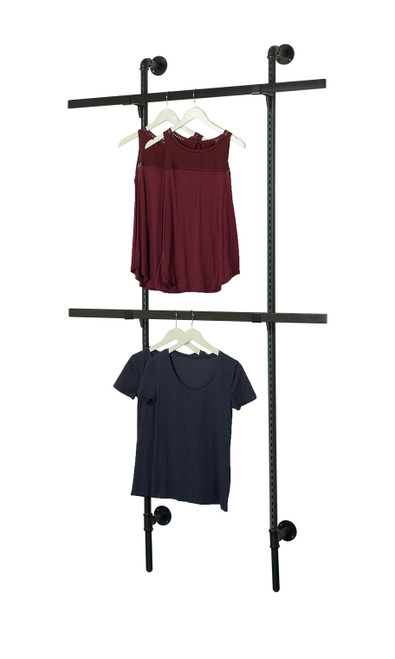 An image of the Boutique Pipe Outrigger System Kit 3 with clothing hanging from it